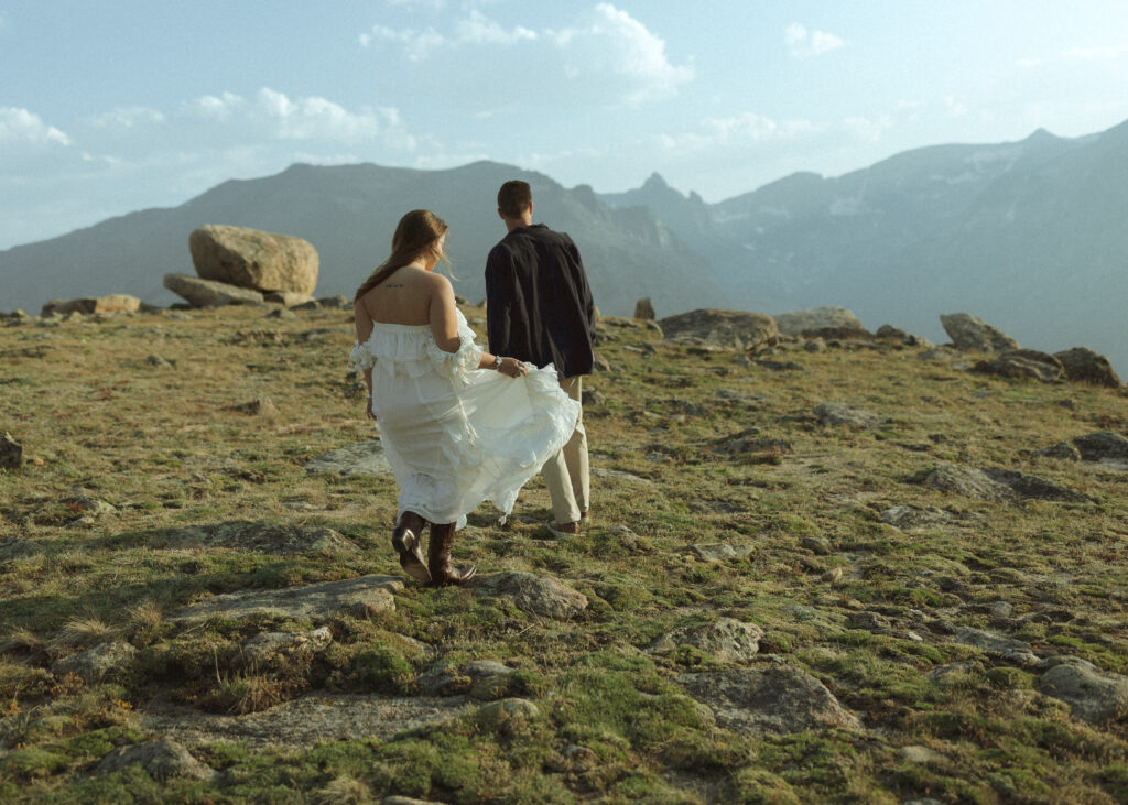 couple walking for their anniversary photos at Rocky Mountain National Park 