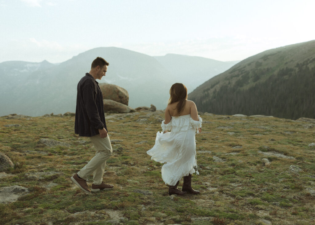 couple walking for their anniversary photos at Rocky Mountain National Park 