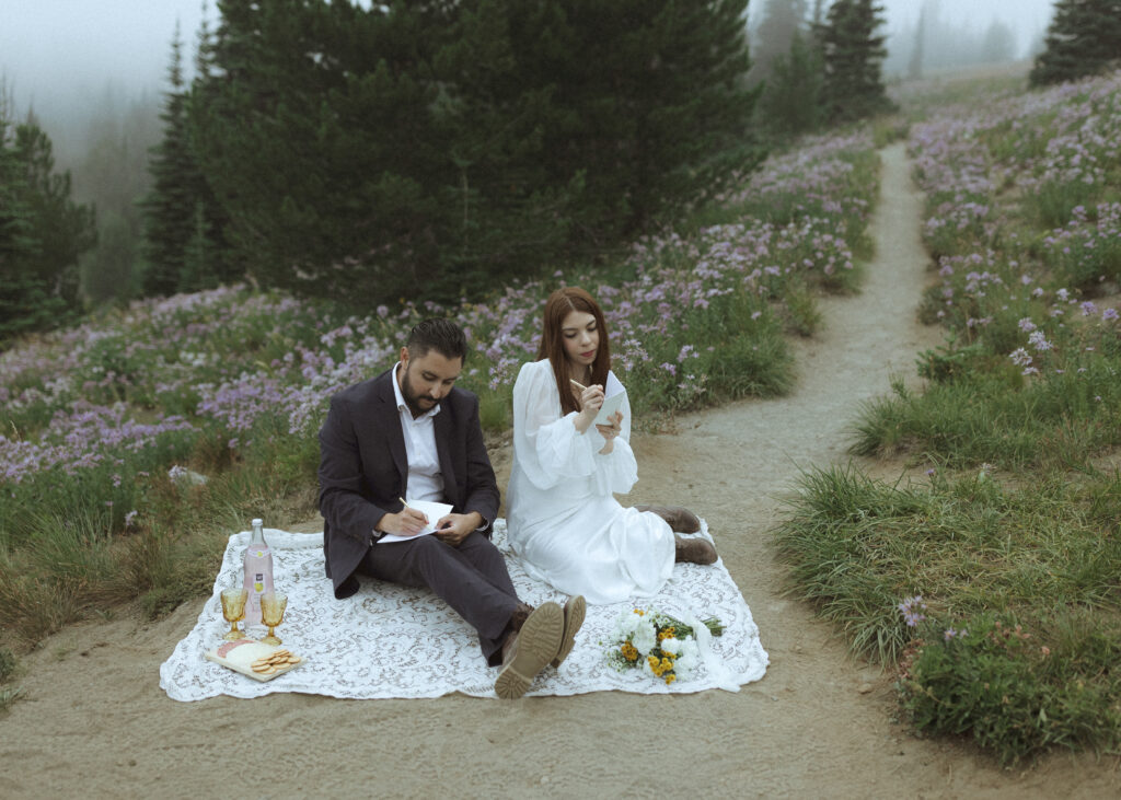 bride and groom writing their vows for their silver forest trail elopement 