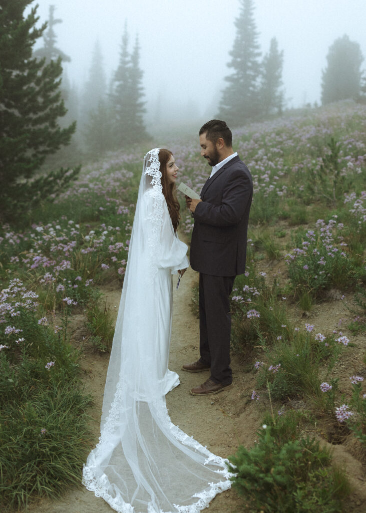 bride and groom reading their vows for their silver forest trail elopement 