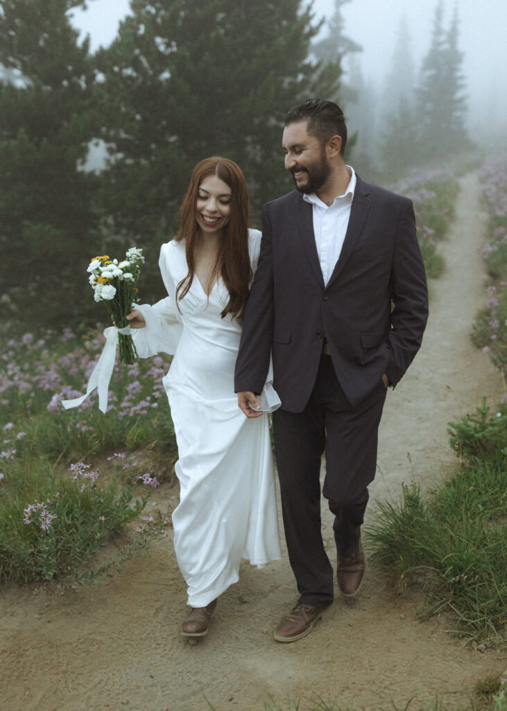 bride and groom taking photos at their silver forest trail elopement 