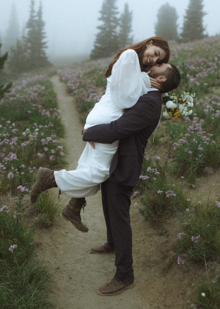 bride and groom taking photos at their silver forest trail elopement 