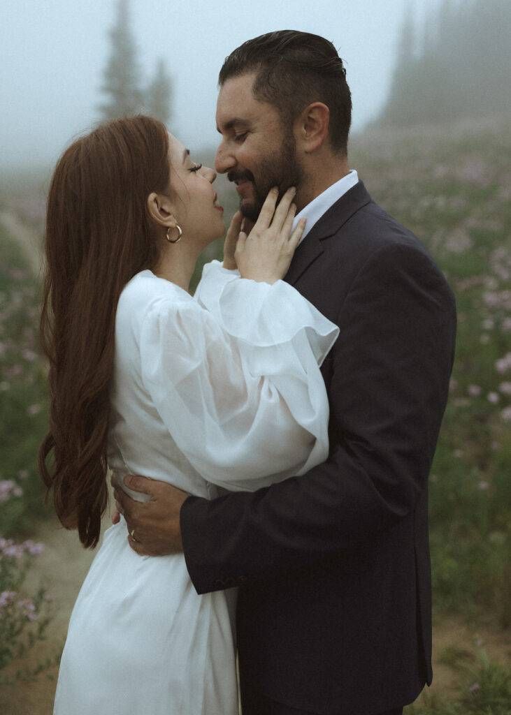 bride and groom taking photos at their silver forest trail elopement 