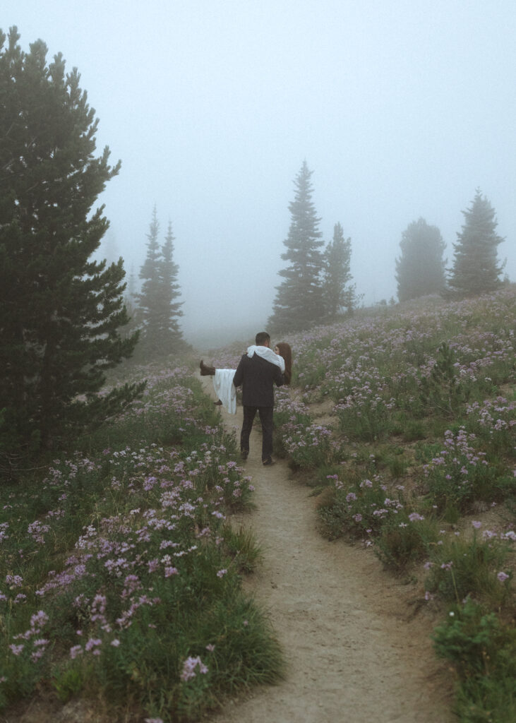 bride and groom taking photos at their silver forest trail elopement 