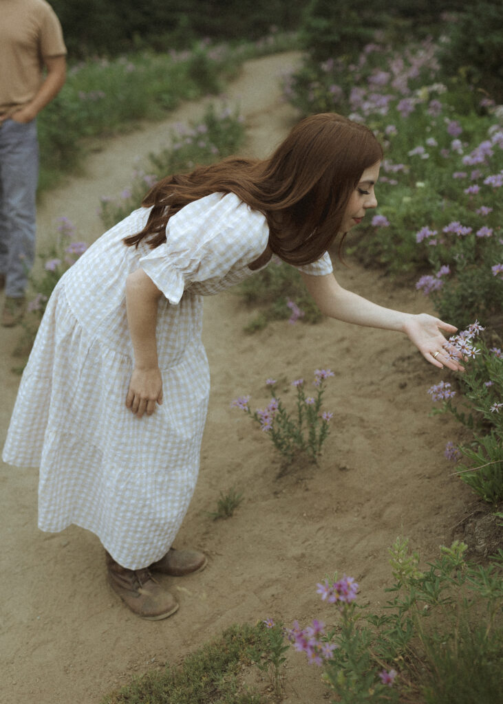 bride and groom taking photos in their casual outfit for their silver forest trail elopement 