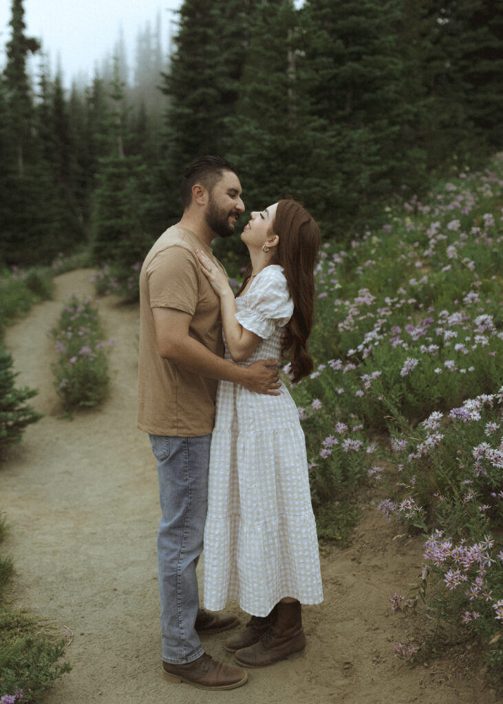 bride and groom taking photos in their casual outfit for their silver forest trail elopement 