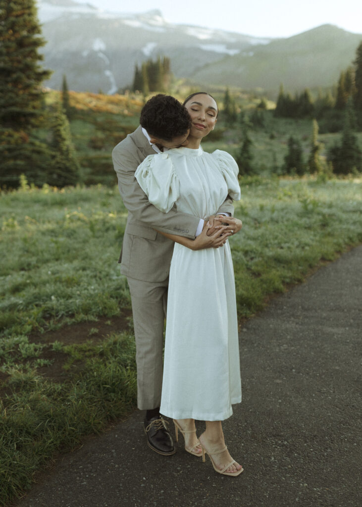 bride and groom taking photos for their skyline trail elopement 