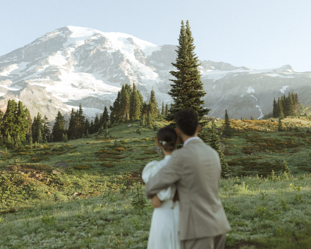 bride and groom taking photos for their skyline trail elopement 