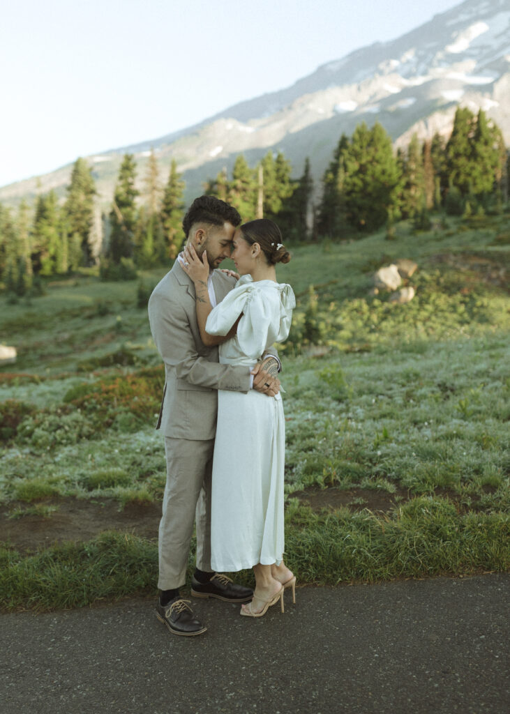 bride and groom taking photos for their skyline trail elopement 