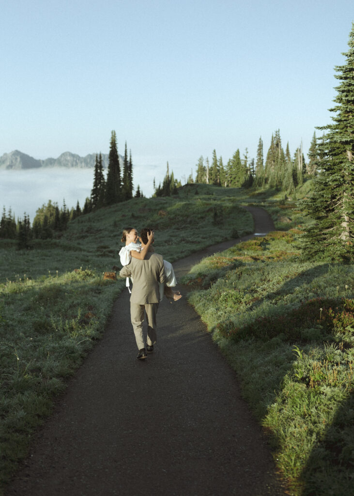 bride and groom walking on the trail for their skyline trail elopement 