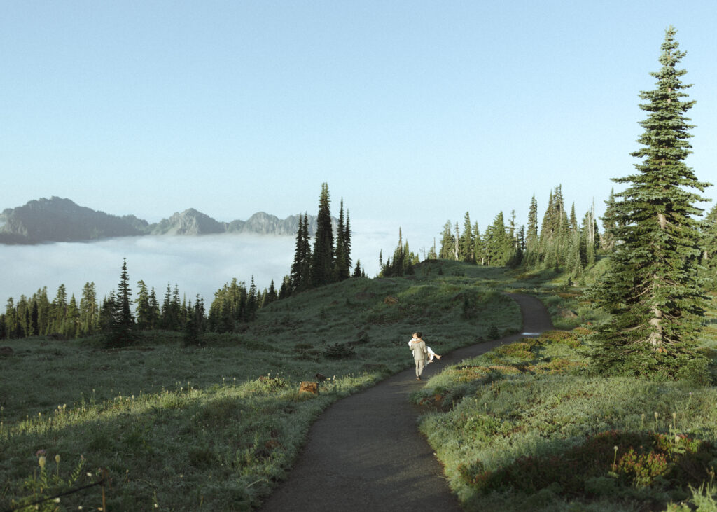 bride and groom walking on the trail for their skyline trail elopement 