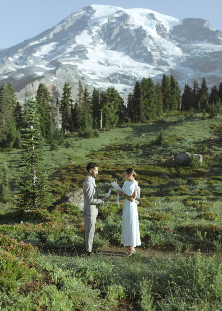 bride and groom reading vows for their skyline trail elopement 