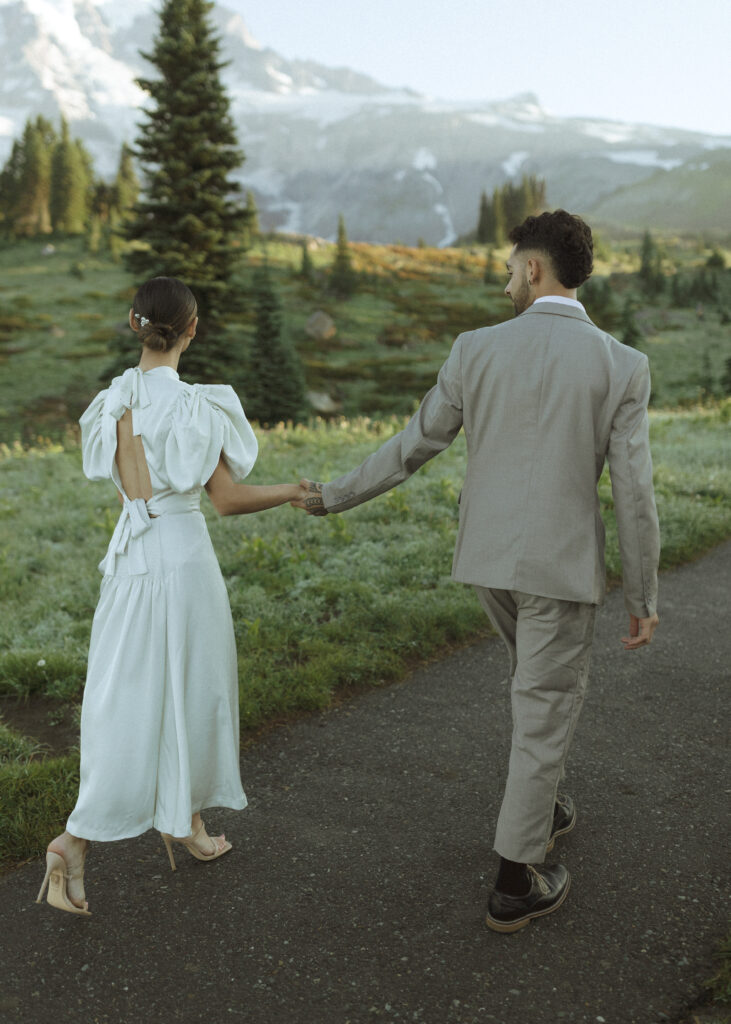 bride and groom taking photos for their skyline trail elopement 