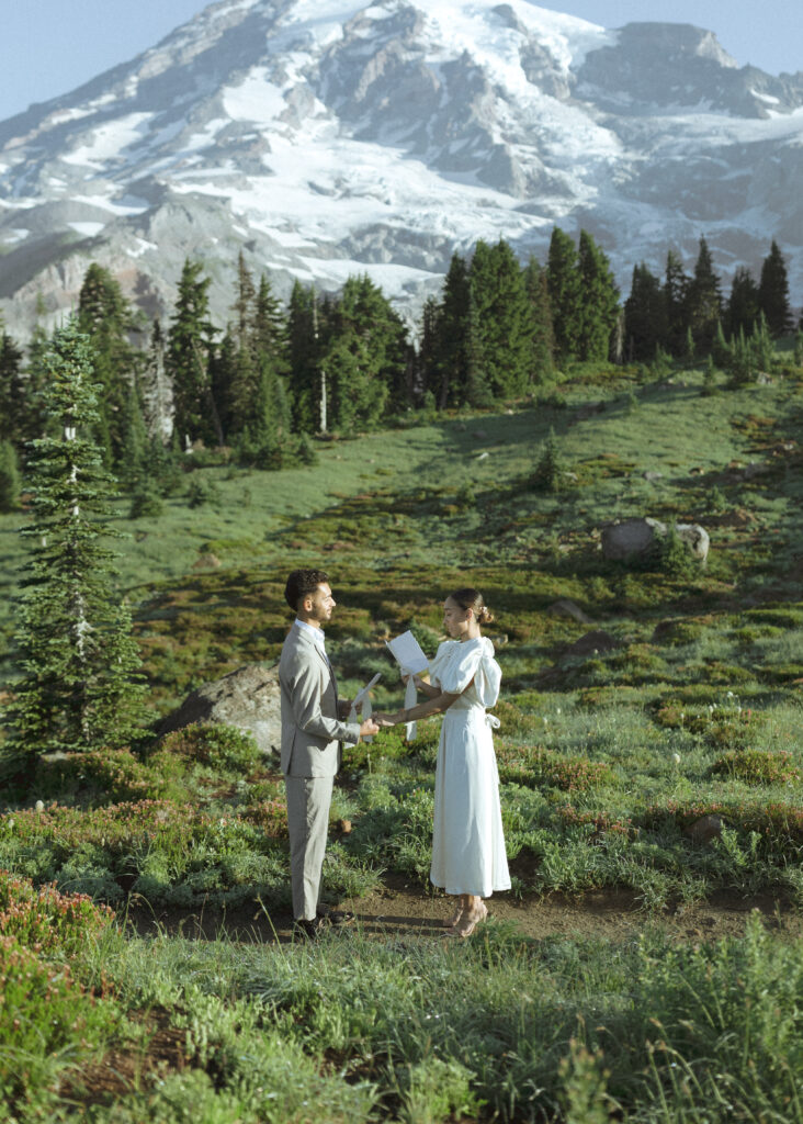 bride and groom reading vows for their skyline trail elopement 