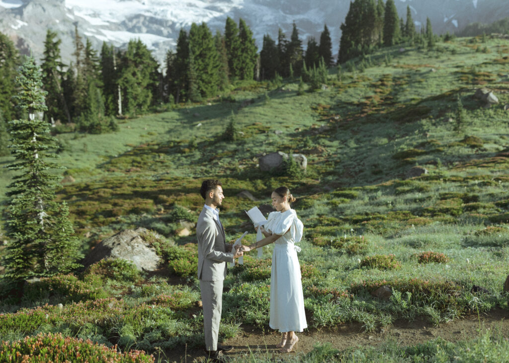 bride and groom reading vows for their skyline trail elopement 