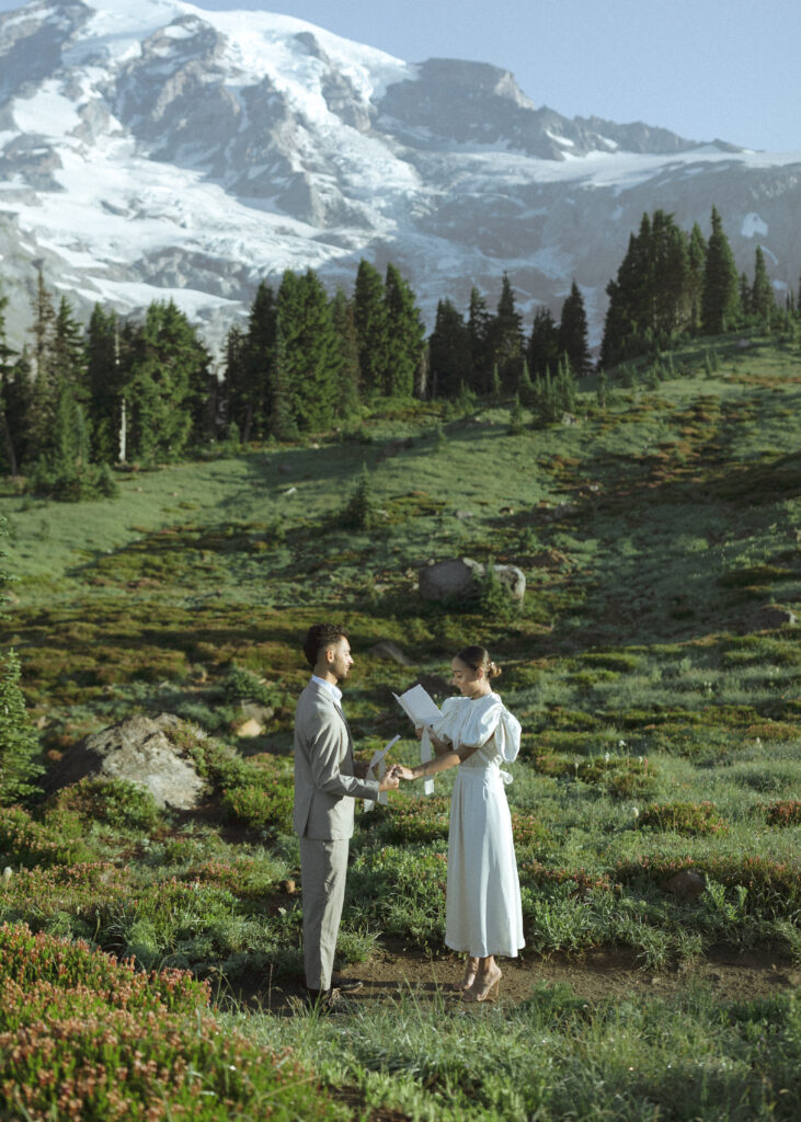 bride and groom reading vows for their skyline trail elopement 