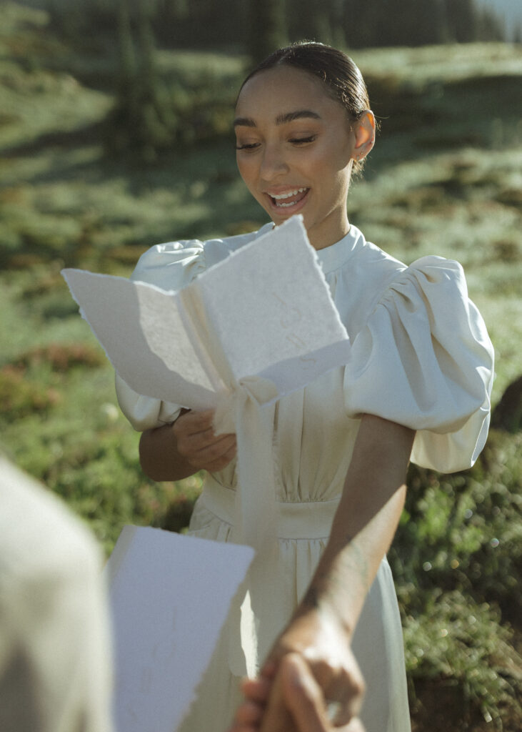 bride and groom reading vows for their skyline trail elopement 