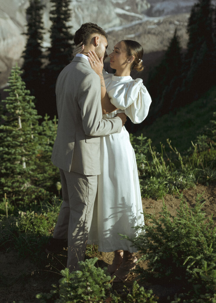 bride and groom taking photos for their skyline trail elopement 