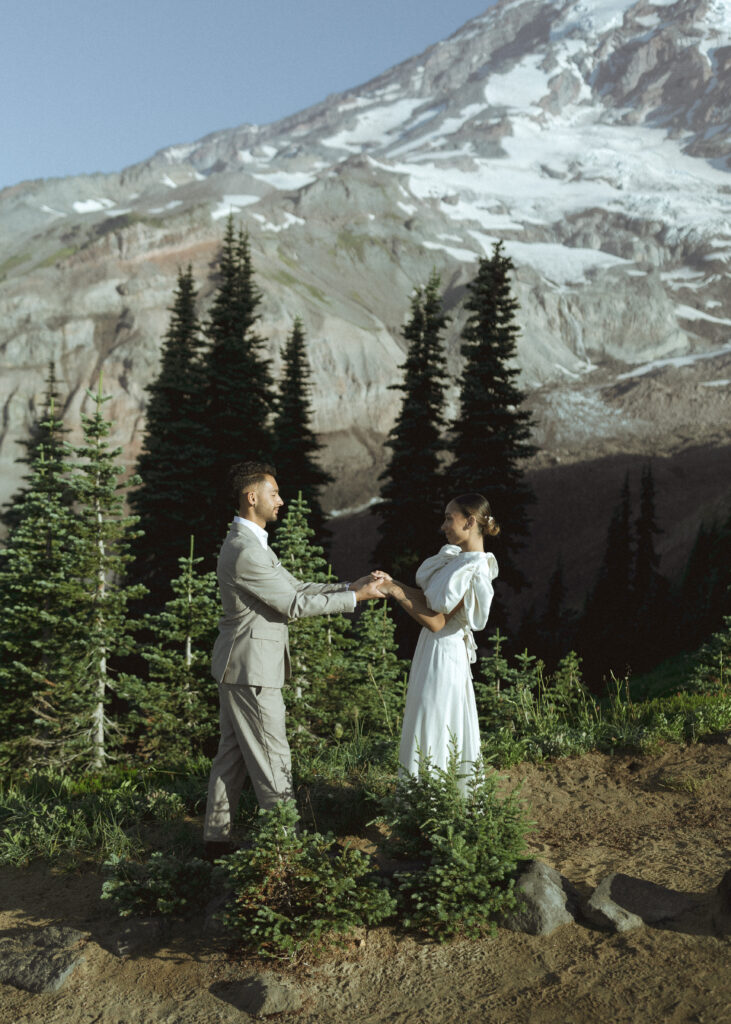 bride and groom taking photos for their skyline trail elopement 