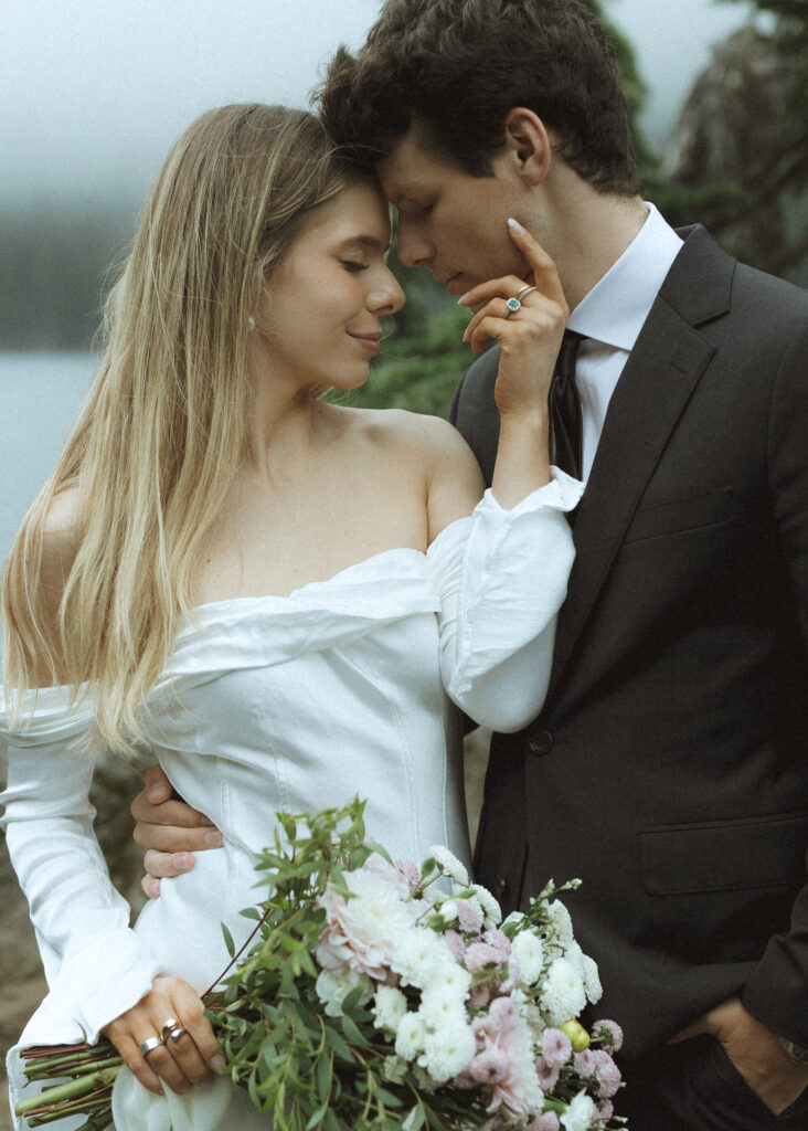 bride and groom taking photos at their mountain wedding 