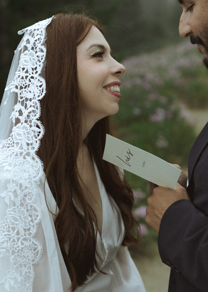 couple reading their vows at their mountain wedding 