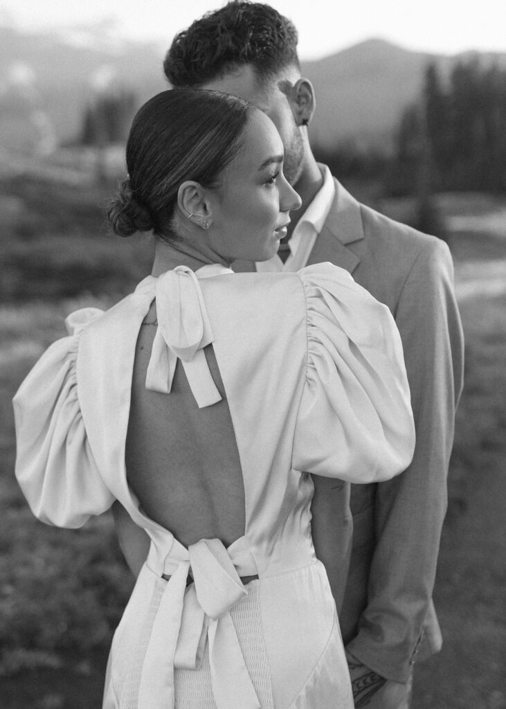 bride and groom taking photos at their mountain wedding 