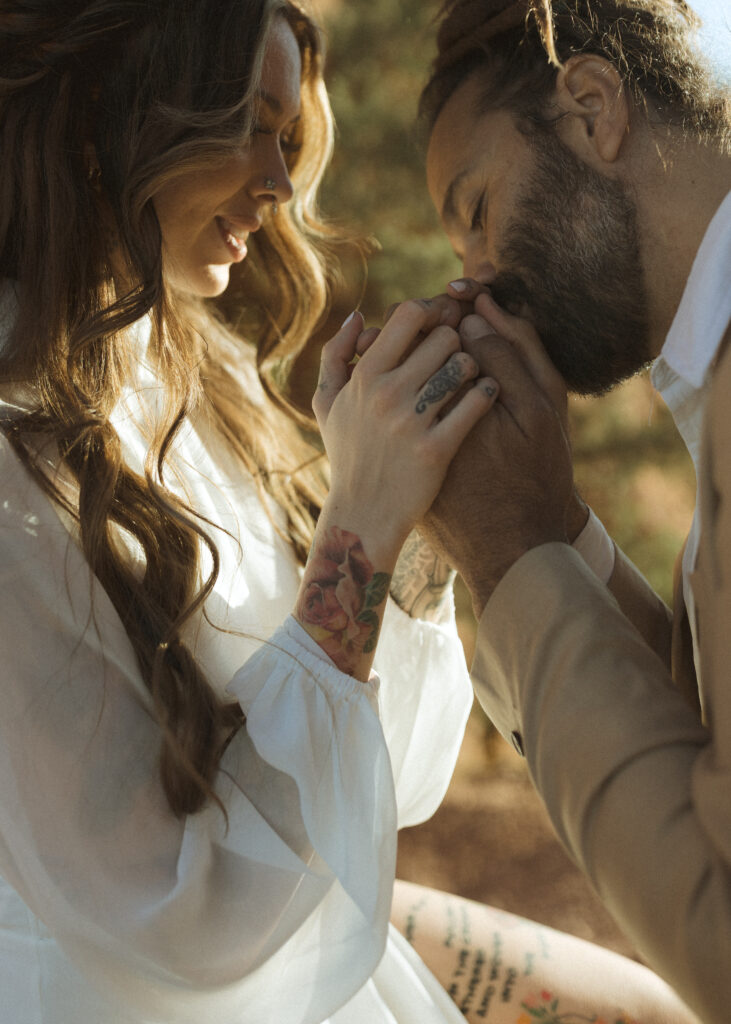 bride and groom taking photos for their Cathedral Rock Elopement 