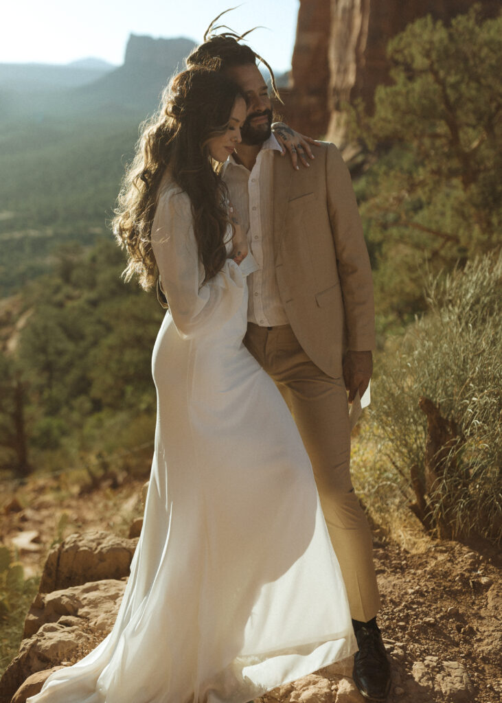 bride and groom reading vows  for their Cathedral Rock Elopement 