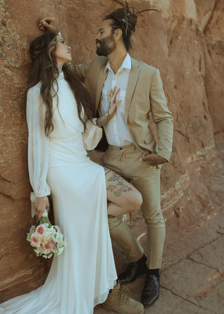 bride and groom taking photos for their Cathedral Rock Elopement 