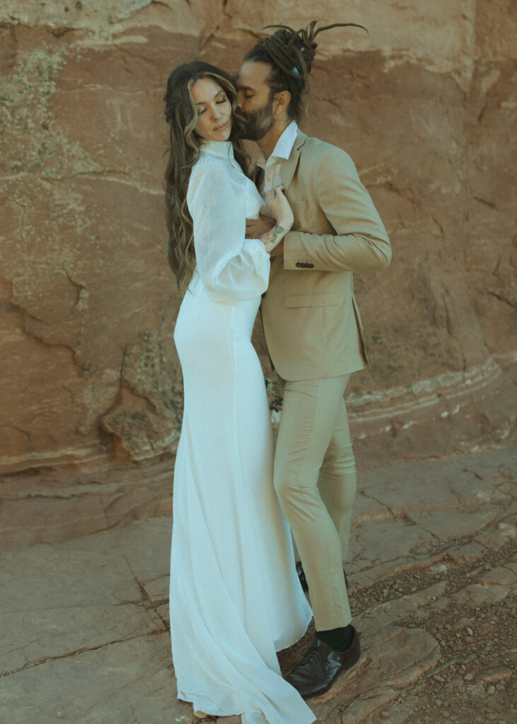 bride and groom taking photos for their Cathedral Rock Elopement 