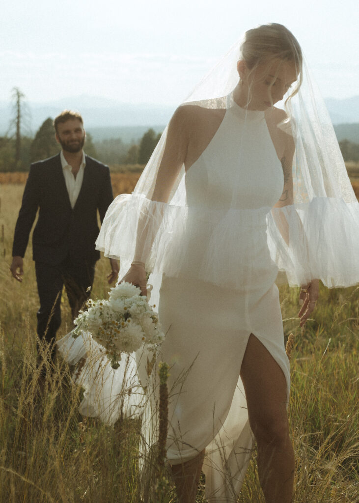 bride and groom walking for their fall flagstaff elopement