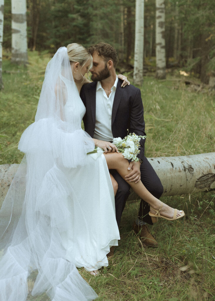 bride and groom taking photos for their fall flagstaff elopement