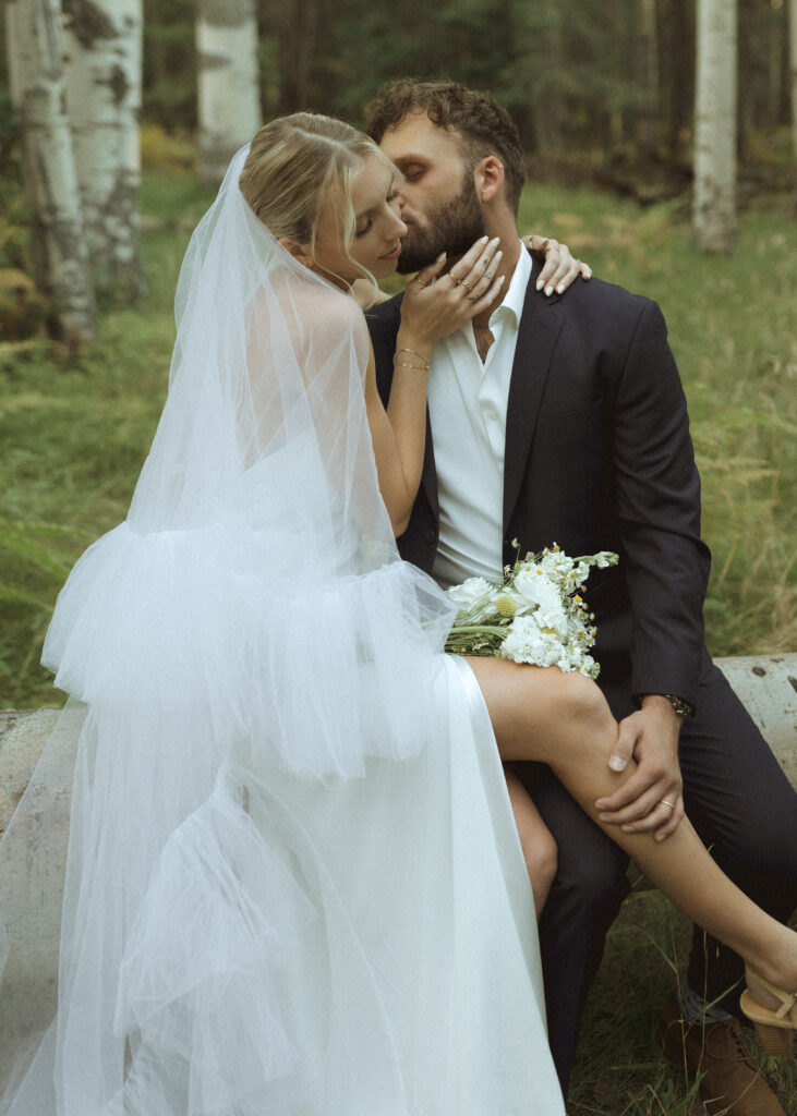 bride and groom taking photos for their fall flagstaff elopement