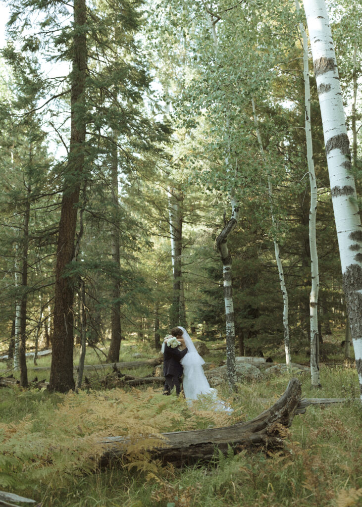 bride and groom taking photos for their fall flagstaff elopement