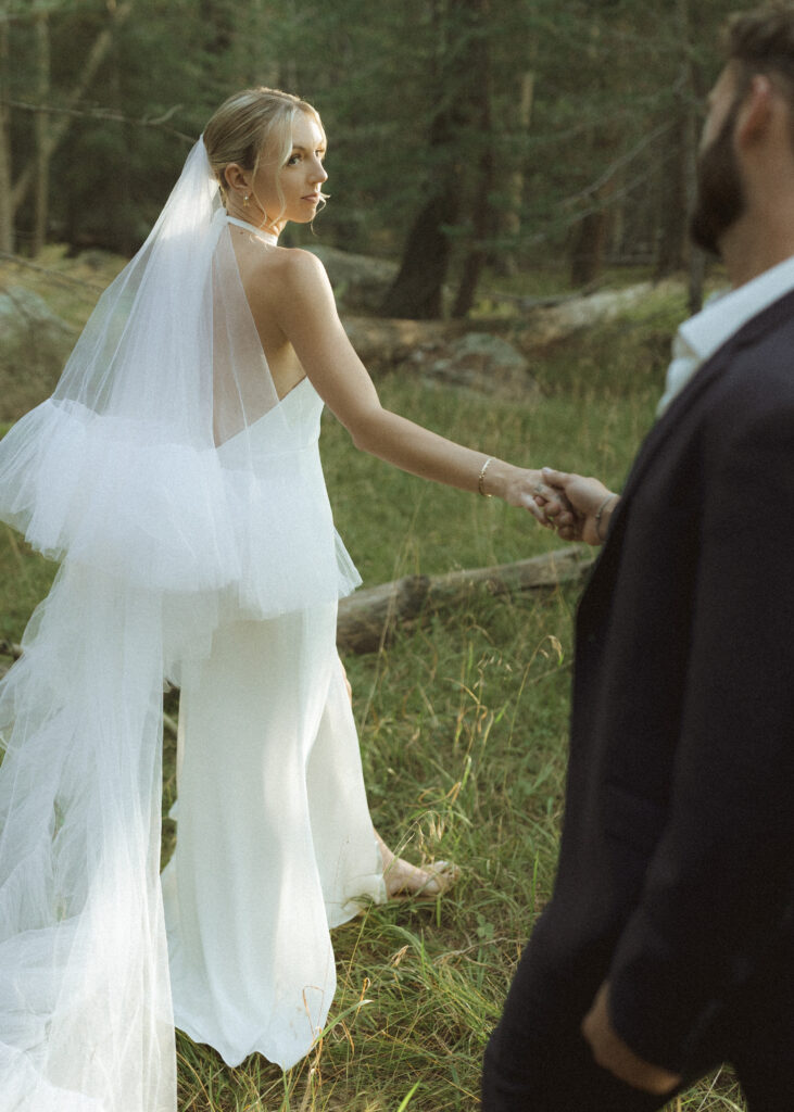 bride and groom walking for their fall flagstaff elopement