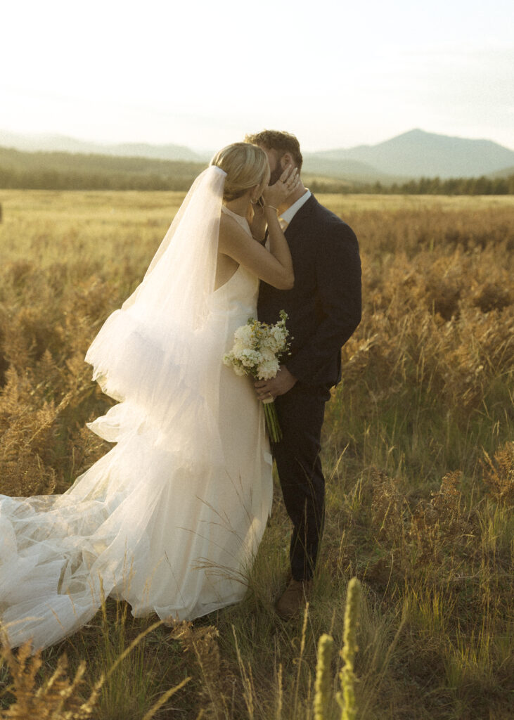 bride and groom taking photos for their fall flagstaff elopement