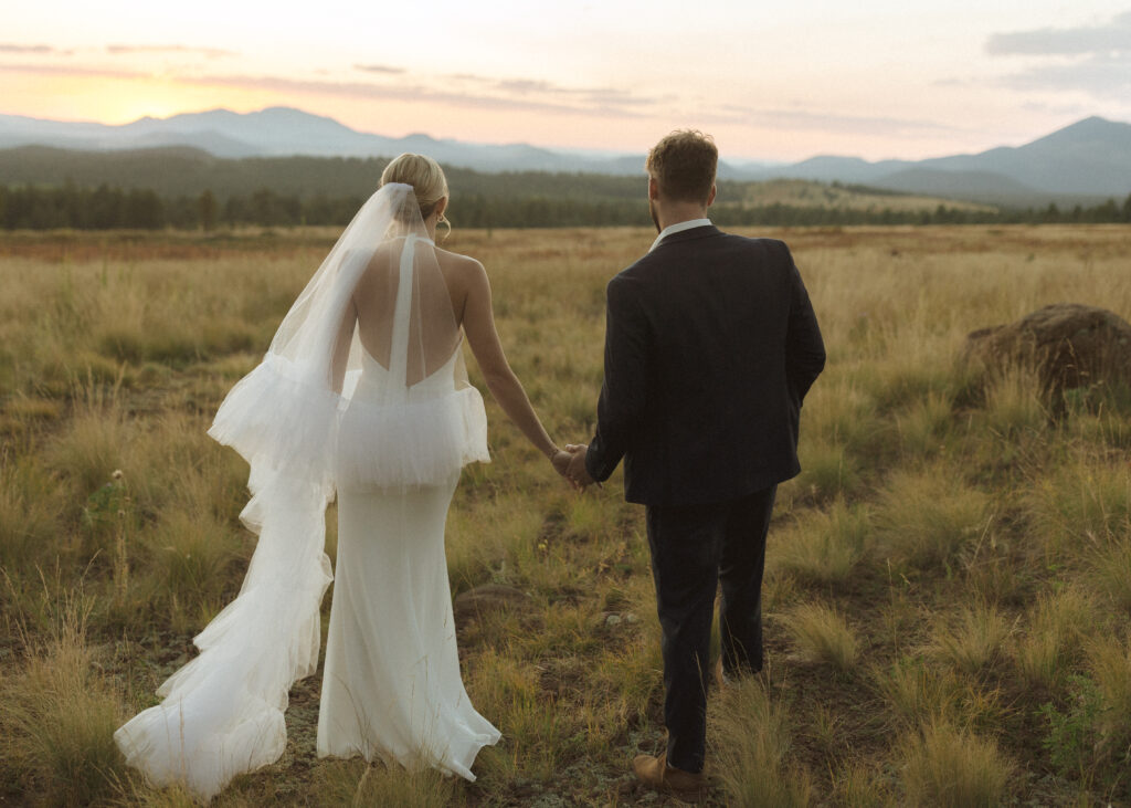 bride and groom walking for their fall flagstaff elopement