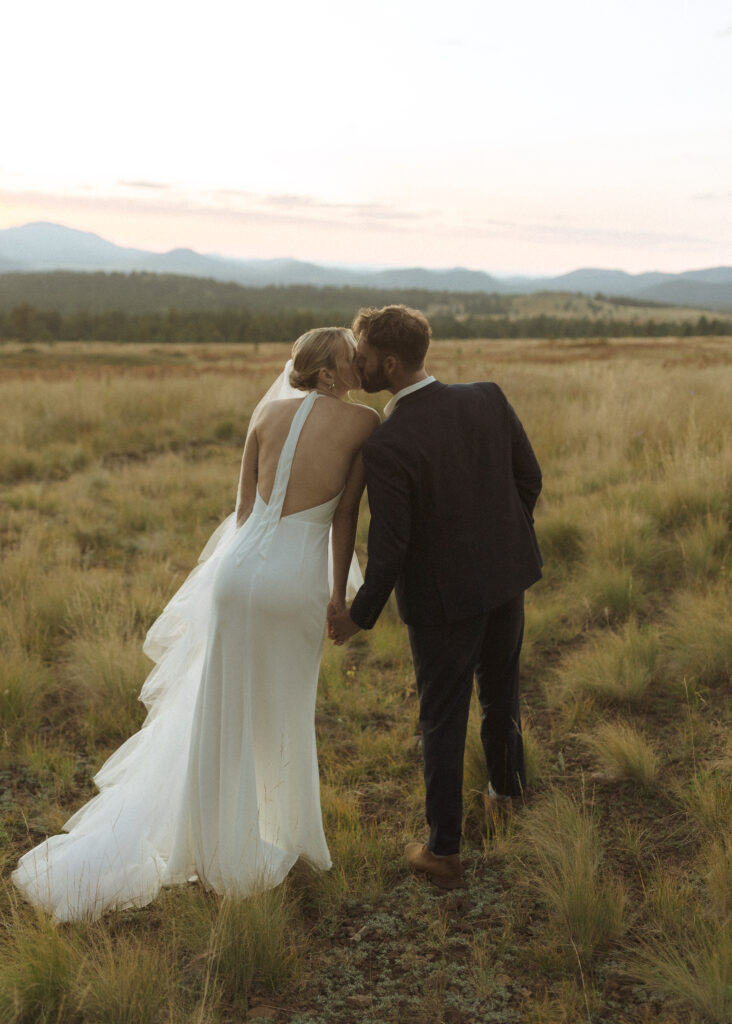 bride and groom walking for their fall flagstaff elopement