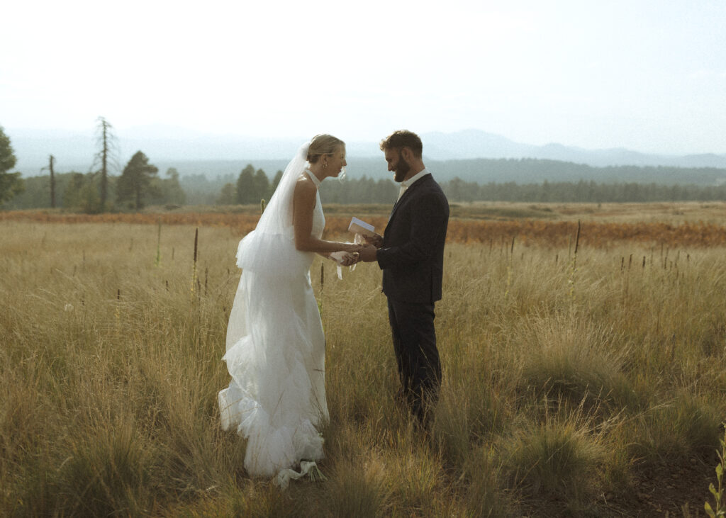 bride and groom reading vows for their fall flagstaff elopement