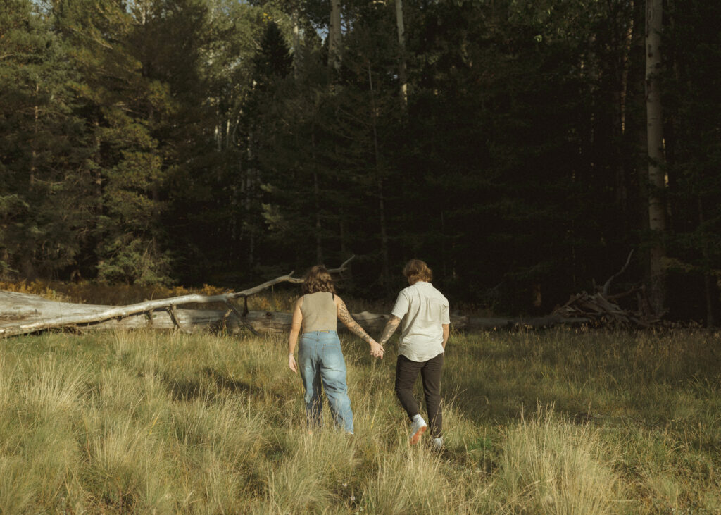 couple walking for their flagstaff engagement photos