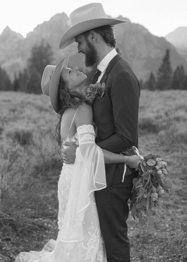 bride and groom taking sunset photos for their fall Grand Teton Elopement 