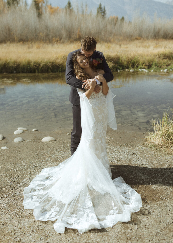 Bride and groom taking photos in Grand Teton National Park 