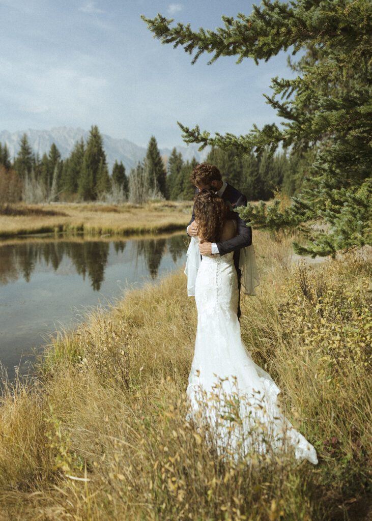 Bride and groom taking photos in Grand Teton National Park 