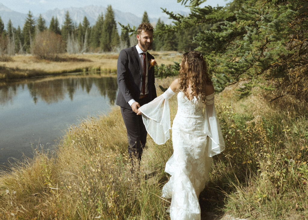 Bride and groom taking photos in Grand Teton National Park 