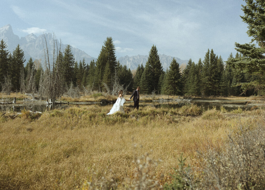 Bride and groom taking photos in Grand Teton National Park 