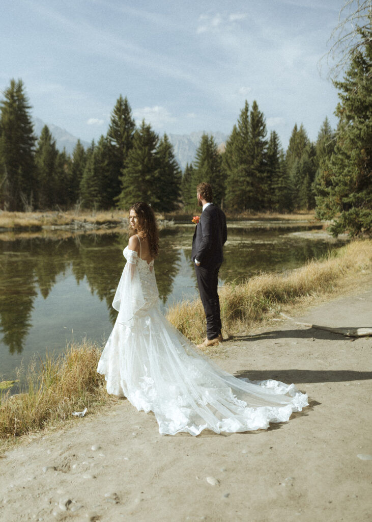 Bride and groom taking photos in Grand Teton National Park 