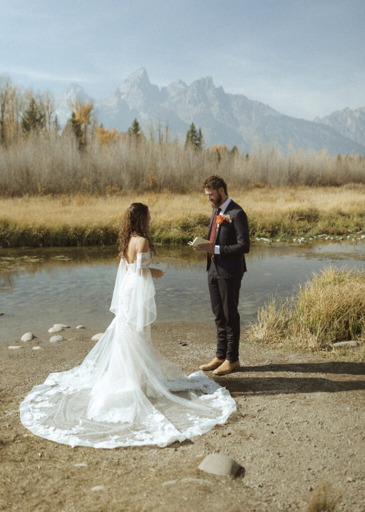 bride and groom reading their vows privately for their Grand Teton elopement 