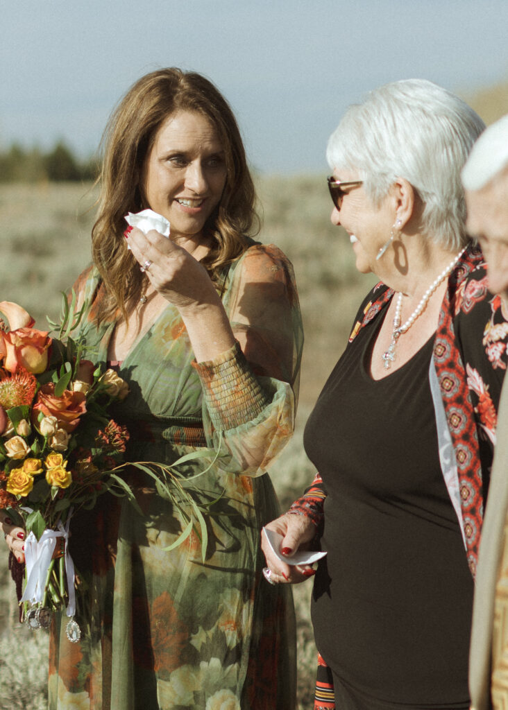 brides family tearing up at their fall Grand Teton National Park ceremony