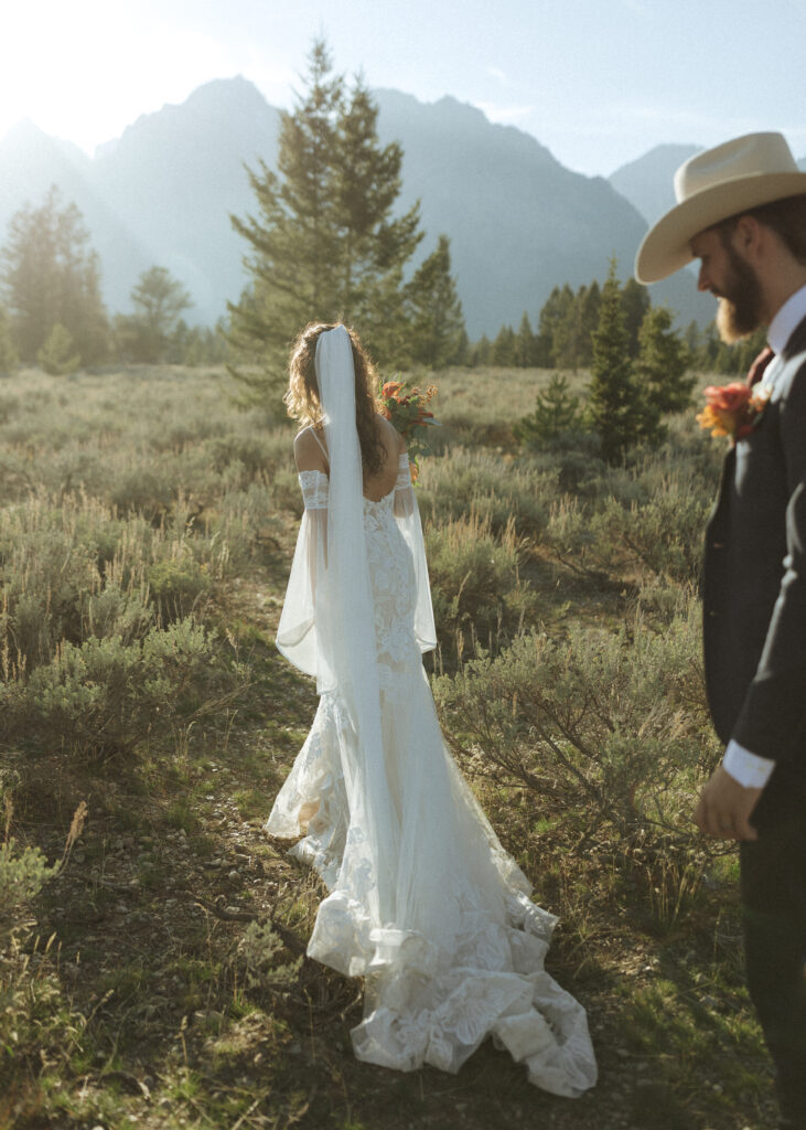 bride and groom taking sunset photos for their fall Grand Teton Elopement 