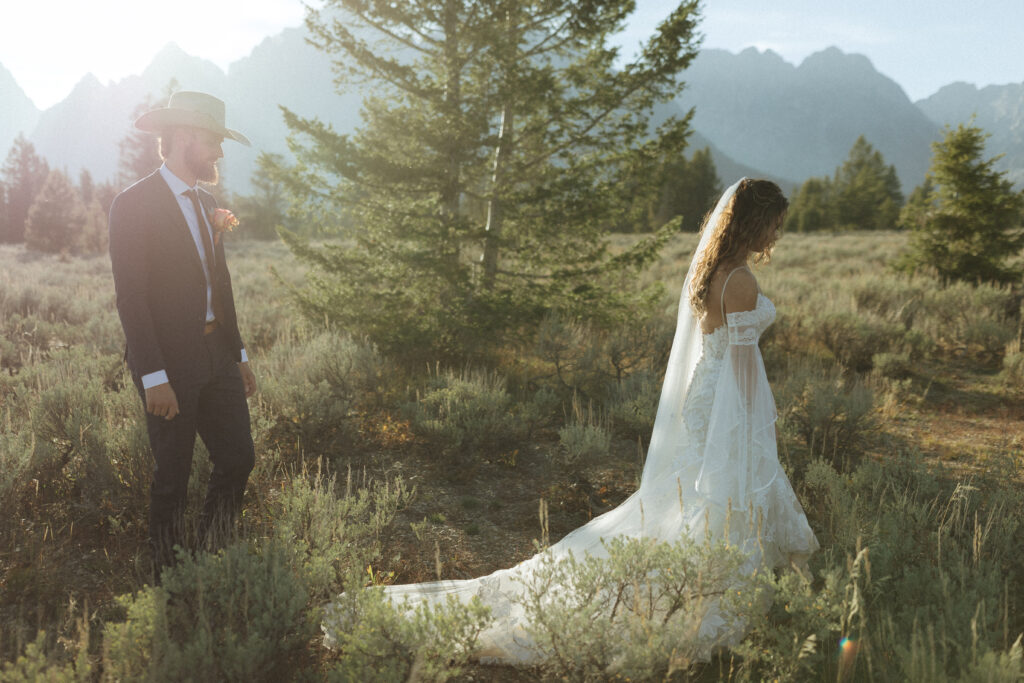 bride and groom taking sunset photos for their fall Grand Teton Elopement 